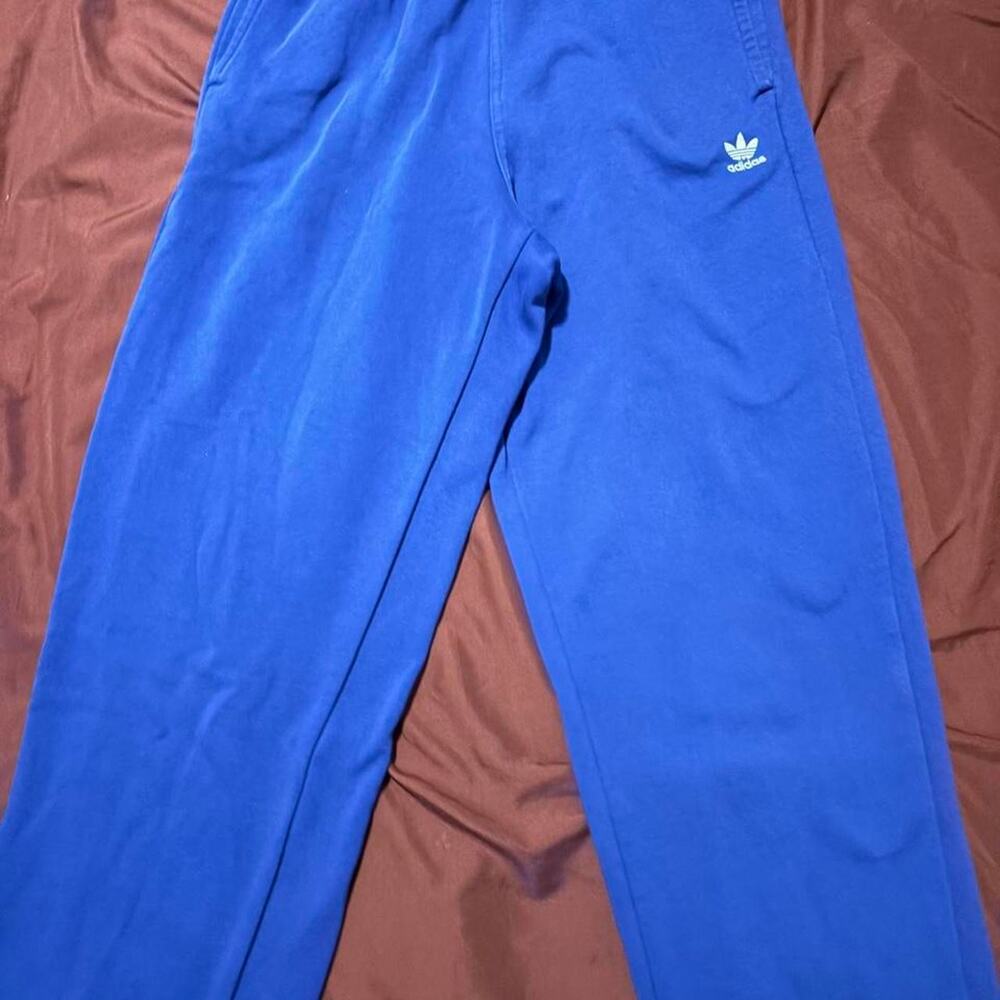 Blue adidas sweatpants with white logo